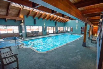 a large swimming pool in a building with a large pool at Mountainside Trailview Condo: Cozy Frisco Retreat in Frisco
