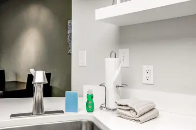 a bathroom sink with a bottle of soap and towels at Mountainside Trailview Condo: Cozy Frisco Retreat in Frisco