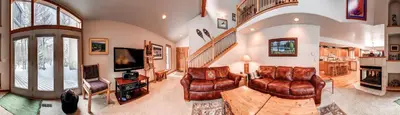 a living room with leather furniture and a tv at Village Townhome: Views, Location in Frisco