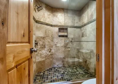 a bathroom with a shower with a glass door at Stonebridge Townhome: Remodeled, Quiet Frisco Location in Frisco