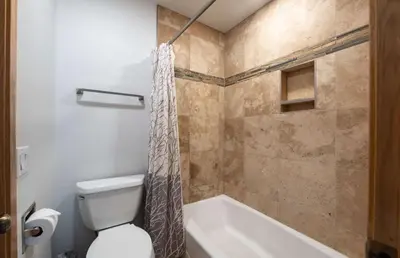 a bathroom with a toilet and a tub and a shower at Stonebridge Townhome: Remodeled, Quiet Frisco Location in Frisco