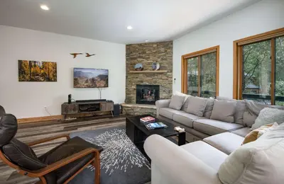a living room with a couch and a fireplace at Stonebridge Townhome: Remodeled, Quiet Frisco Location in Frisco