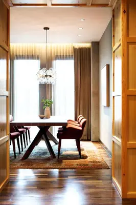 a dining room with a table and a chair at Limelight Hotel Denver in Denver