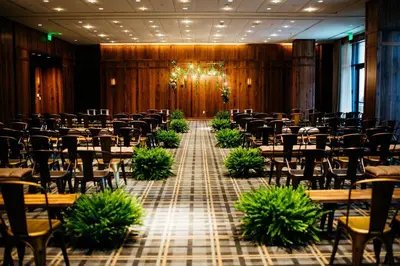 an empty banquet hall with tables and chairs at Limelight Hotel Denver in Denver