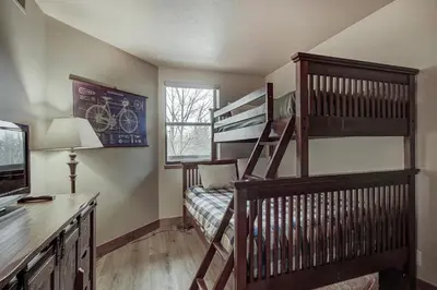 a small room with a bunk bed and a bunk bed at 241C Mountain Side Condo in Frisco