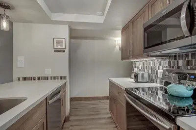 a kitchen with a sink and a stove top oven at 241C Mountain Side Condo in Frisco