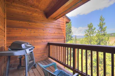 a screened in porch with a grill on a deck at 127 Lookout Ridge Townhouse in Dillon
