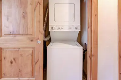 a washer and dryer in a room next to a door at Ffd7 Frostfire Condo in Keystone