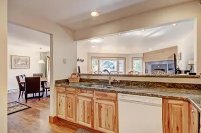 a kitchen with a sink and a large mirror at Ffd7 Frostfire Condo in Keystone