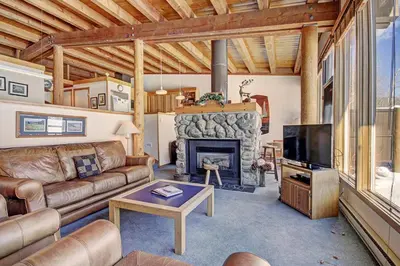a living room with a couch and a fireplace at 2035 Homestead Condo in Keystone