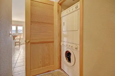 a kitchen with a washer and dryer in a room at 522 Watch Hill Condo in Silverthorne