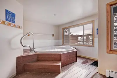 a bath tub in a room with a window at 522 Watch Hill Condo in Silverthorne