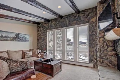 a living room with a couch and a table at A308 Lake Cliffe Condo in Dillon