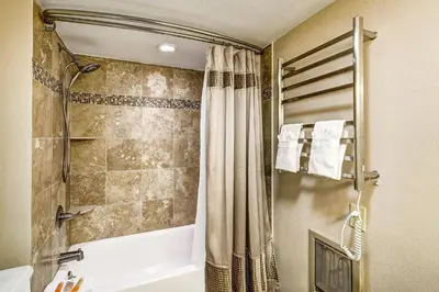 a bathroom with a shower with a shower curtain at 1088 Wild Irishman Condo in Keystone