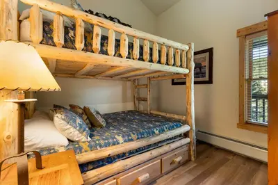 a bedroom with a bunk bed and a lamp at 2674 Tenderfoot Lodge Condo in Keystone