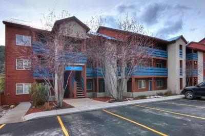 a parking lot in front of a building at C213 Cinnamon Ridge Condo in Keystone