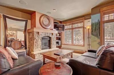 a living room with a couch and a fireplace at 3044 Lone Eagle Condo in Keystone