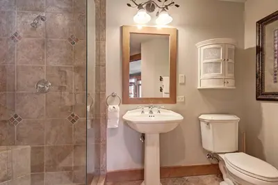 a bathroom with a toilet and a sink and a shower at 3044 Lone Eagle Condo in Keystone