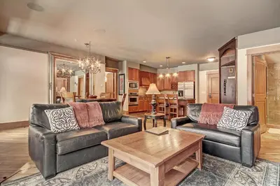 a living room with two leather couches and a table at 3044 Lone Eagle Condo in Keystone