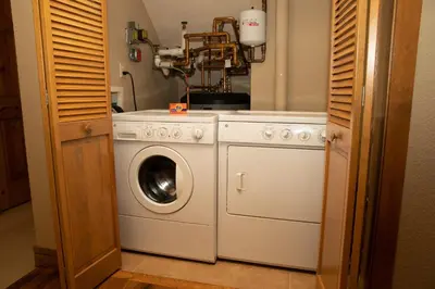 a washer and dryer in a kitchen next to a door at 6532 Settlers Creek Condo in Keystone