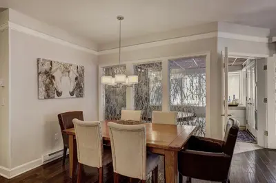 a dining room with a table and chairs at 2721 Chateaux DMont Condo in Keystone