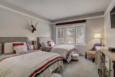 a bedroom with two beds and a window at 2721 Chateaux DMont Condo in Keystone