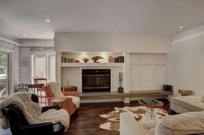 a living room with a couch and a fireplace at 2721 Chateaux DMont Condo in Keystone