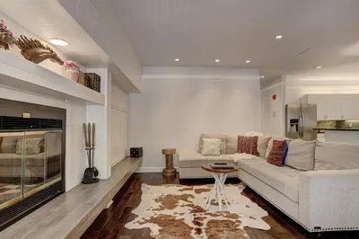 a living room with a couch and a fireplace at 2721 Chateaux DMont Condo in Keystone