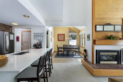 a kitchen and living room with a fireplace at 1610 Quicksilver Condo in Keystone