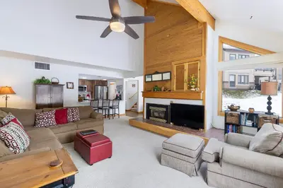 a living room with a couch and a fireplace at 1610 Quicksilver Condo in Keystone