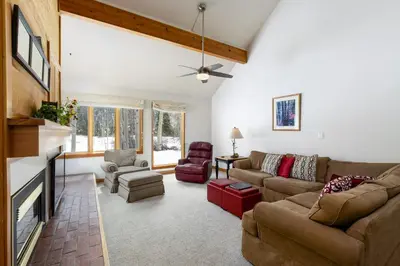 a living room with a couch and a fireplace at 1610 Quicksilver Condo in Keystone