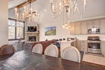 a kitchen with a table and chairs in a room at 78 Alders Townhouse with Heated Garage in Keystone