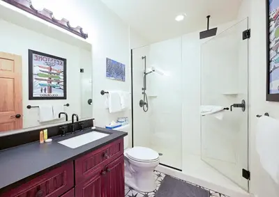 a bathroom with a shower and a toilet and a sink at 202 Mill Creek Condo in Keystone