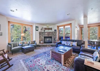 a living room with a couch and a fireplace at 202 Mill Creek Condo in Keystone
