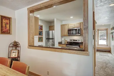 a kitchen with a mirror on the wall at 2062 The Pines Condo in Keystone