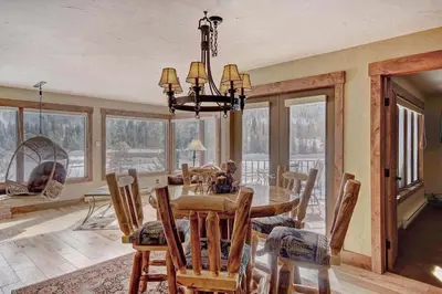 a dining room with a table and chairs at 1710 the Willows Condo in Snake River Health Services Incorporated Heliport
