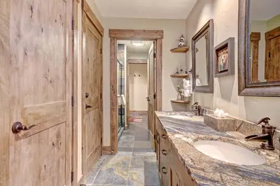 a bathroom with a sink and a large mirror at 1710 the Willows Condo in Snake River Health Services Incorporated Heliport