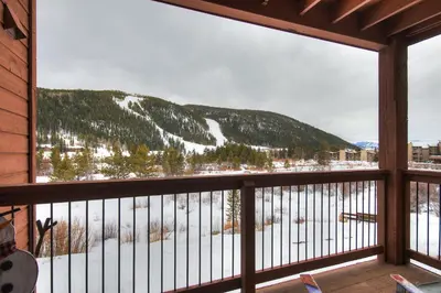 a balcony with a view of a snowy mountain at C212 Cinnamon Ridge Condo in Keystone