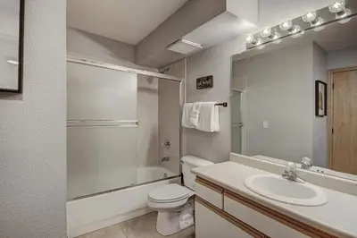 a bathroom with a sink and a toilet and a shower at C212 Cinnamon Ridge Condo in Keystone