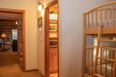 a room with a staircase and a room with a bunk bed at 13 Bear Tree Court Condo in Keystone