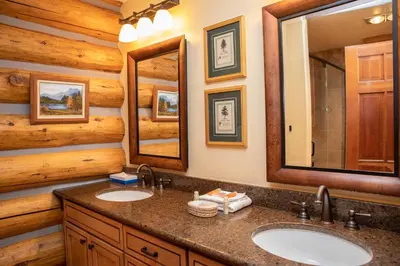 a bathroom with two sinks and a mirror at 13 Bear Tree Court Condo in Keystone