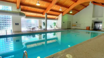 a large swimming pool in a large building at 1633 Quicksilver Condo in Keystone