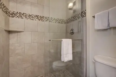 a bathroom with a shower stall with a toilet at 1633 Quicksilver Condo in Keystone