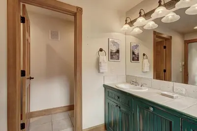 a bathroom with a sink and a mirror at 201 Mill Creek Condo in Keystone