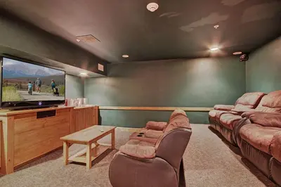 a living room with couches and a flat screen tv at 8912 The Springs Condo in Keystone
