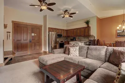 a living room with a couch and a table at 8912 The Springs Condo in Keystone