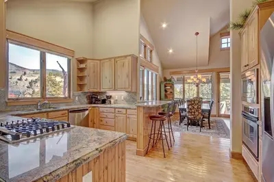 a kitchen with wooden cabinets and a counter top at 170 Elk Circle Condo in Keystone