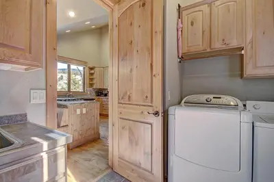a kitchen with a washer and dryer in it at 170 Elk Circle Condo in Keystone