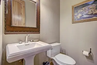 a bathroom with a white sink and a toilet at 170 Elk Circle Condo in Keystone