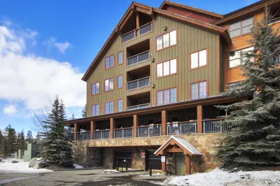 a large wooden building with windows and balconies at 8824 The Springs Condo in Keystone